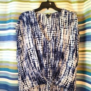 A cute tie die top with knot at bottom